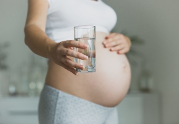 Why is it so important to consume enough fluids during pregnancy